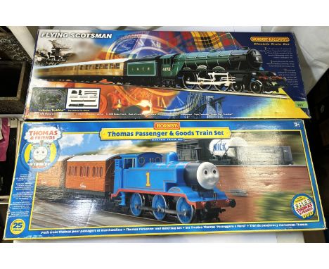 A Hornby Railways Flying Scotsman train set boxed (mat missing); A Thomas the Tank Train set (no track)
