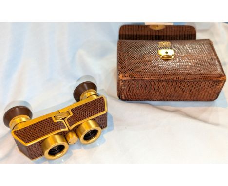 A Vintage snakeskin-effect cased set of Carl Zeiss Jena theatre/opera glasses.