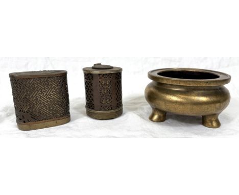 A Chinese brass censer on three feet with impressed seal mark to base; a Chinese brass cylindrical box with pierced cover, he
