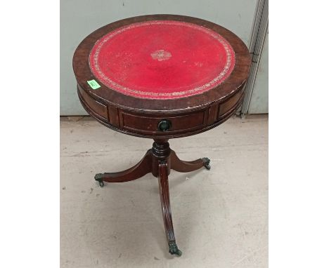 A red leather-effect studded carver chair (seat a/f) and a reproduction tripod drum table with red leather top; a stained woo