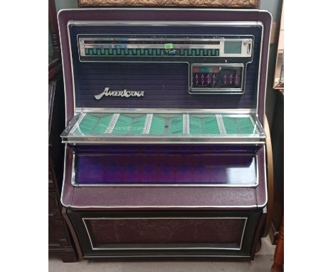 A vintage Wulitzer Jukebox in purple.The Juke Box comes complete with key and has a full complement of records. It was workin