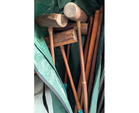 A croquet set in a bag.