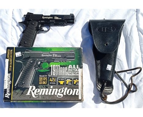 A Remington 1911 RAC air pistol with box and holster