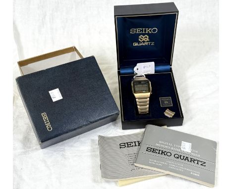 A 1970's gents 'quartz memory bank' calendar wristwatch in yellow metal finish, in Seiko box with original paperwork.