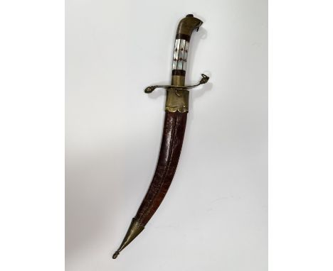 A 19th century Indian dagger with mother of pearl and brass grip, 32cm.