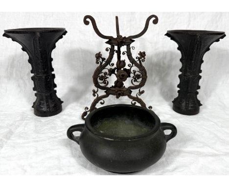 A Chinese bronze two-handled censer with seal mark to the base, dia. 13cm; a pair of Chinese cast metal Gu shaped vases, heig