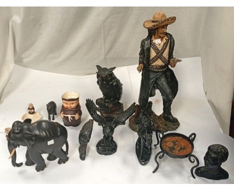 A selection of carved elephants; African busts; Mexican bandits; owl bookend; Hummel figures; bible etc.
