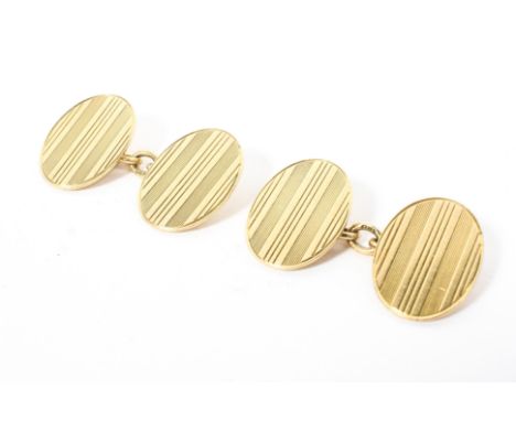 A pair of 18ct gold double oval cufflinks with engine turned decoration, 8.5g. 