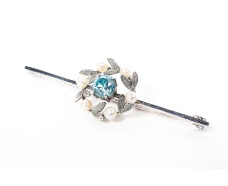A 9ct white gold aquamarine and pearl set wreath brooch, 2.7g. 