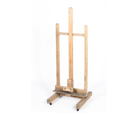 A vintage wooden artist's easel, with adjustable frame, on casters, 158 cm high x 60 cm wide 