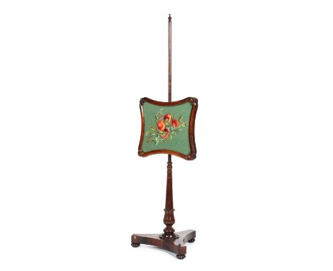 A Victorian rosewood pole fire screen, with cushion-shaped screen decorated with tapestry vignette of fruit, on tapering pole
