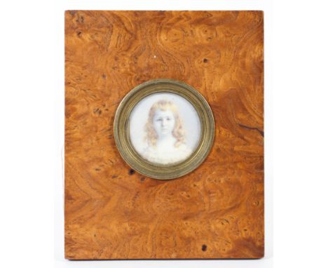 A Victorian portrait miniature of a girl on ivory, in burr oak frame, the miniature 4.5 cm high