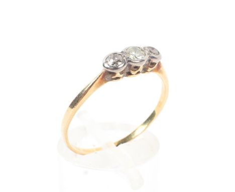 An unmarked yellow metal three stone diamond ring, Size R, 1.7 grams