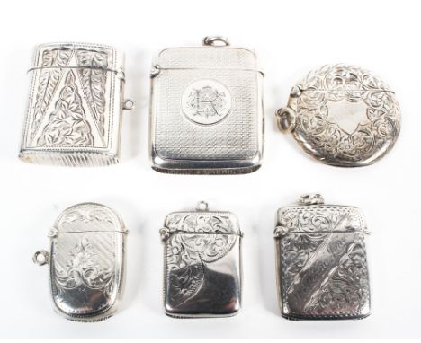 A collection of six hallmarked silver vesta cases, each with either engine turned or engraved decoration, varying designs and