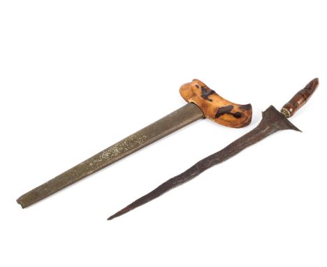 A late 19th century Kriss, with turned and carved handle and hilt, some elements possibly later, with gilt-metal and paste se