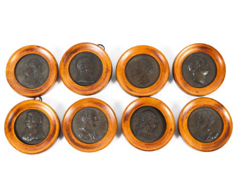 Eight bronzed stoneware framed portrait medallions, early 19th century, each moulded with a bust length portrait with  subjec