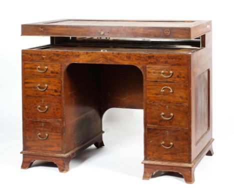 An Edwardian mahogany wash stand, 19th century, with hinged top, concealing white painted wood gallery with various apertures