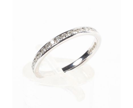 An 18ct white gold and diamond full eternity ring, chanel set line of single cut diamonds, Size J, 1.5g.