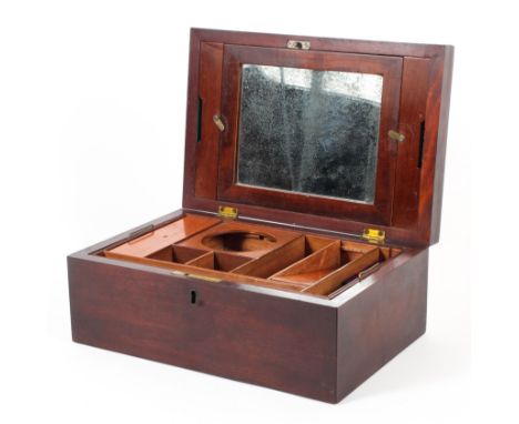 A Victorian mahogany dressing box, the interior fitted with assorted covered compartments and a mirror, 29.8 cm wide 