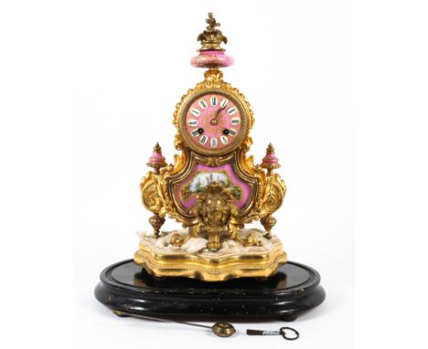 A French Sevres-style pink-ground gilt-metal mounted striking mantle clock, late 19th century, the rocaille case stamped 'W C