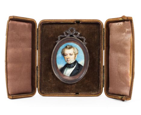 A Victorian portrait miniature of a gentleman on ivory, late 19th century, in ribbon cast scroll frame, cased, the portrait 5