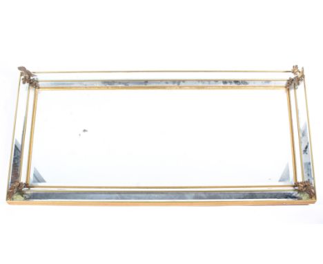 A large gilt-metal mounted bevelled edged rectangular hall mirror, 20th century, each corner applied with a cluster of grapes