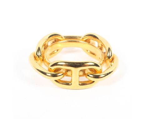 A Hermes yellow metal scarf ring in original box. 
