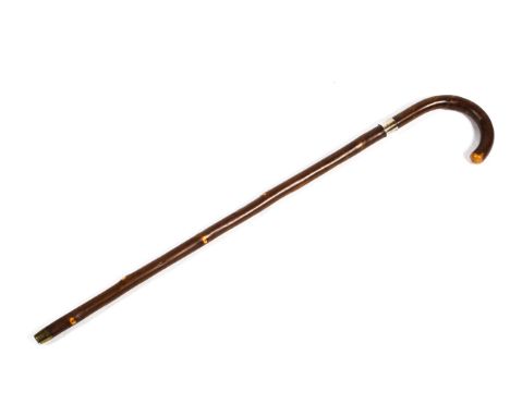 A Victorian walking cane,sword stick with etched blade marked wilkinson Sword. Ltd with white metal collar and brass cap, 86 