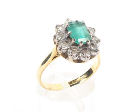 An 18ct gold and emerald and diamond set dress ring, Size O, 4.9g. 