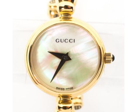 A vintage ladies Gucci quartz wristwatch, gold plated case and strap, mother of pearl dial