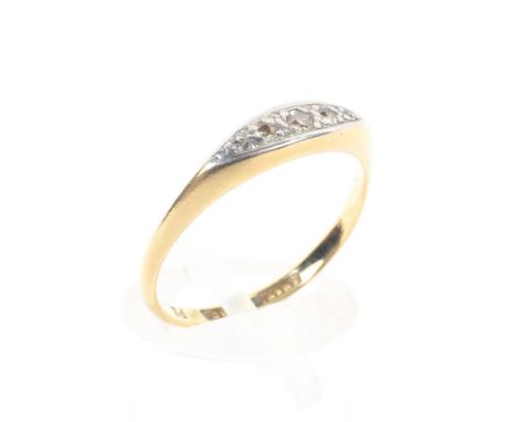 An 18ct gold and platinum diamond set ring, set with five graduated single cut diamonds in an illusion setting. 2.7g. Size O