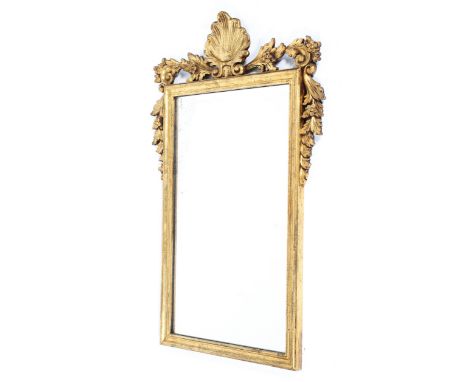 A George III style giltwood mirror frame, with scallop shell cresting and leaf and flowerhead mantling, 19th/early 20th centu