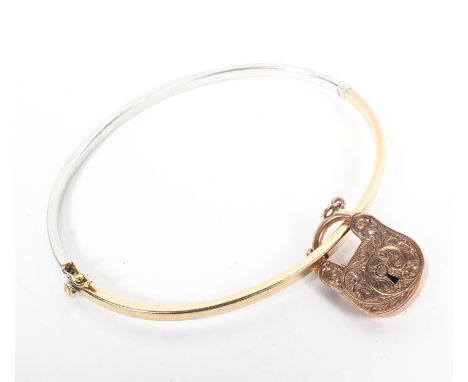 A 9ct white and yellow gold bangle bracelet together with a 9ct rose gold locket. 8.2g. 