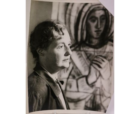 Photograph: Department of External Affairs, Half Length, Portrait of Evie Hone, standing in front of one of her works,  appro