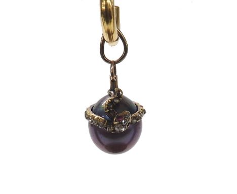Unusual black cultured pearl gold pendant, fashioned with entwined serpents set with rose diamonds and ruby eyes (one ruby mi