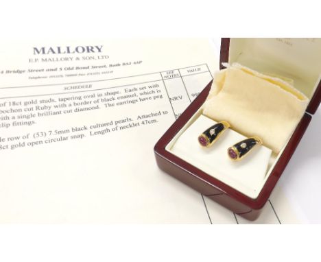 Pair of 18ct gold studs of tapering oval shape, each set with a cabouchon cut ruby within a black enamel border, also set wit