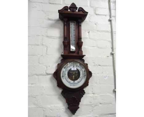 Victorian carved oak aneroid barometer.