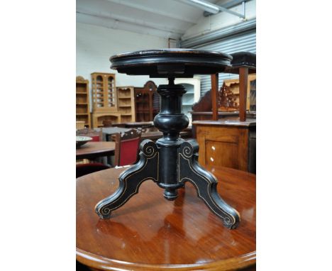 Victorian piano stool, circular wind-up top, red upholstery, ebonised frame, 40cm diam.