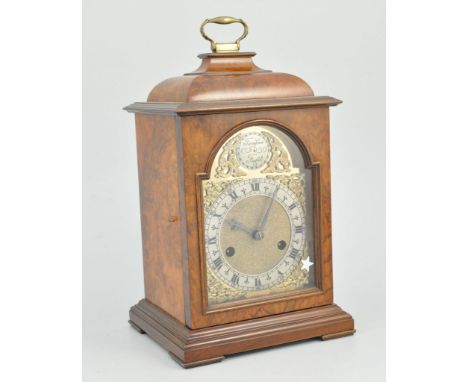 Reproduction walnut cased bracket clock, arched brass dial with silvered chapter ring, Smith's Enfield movement, striking on 