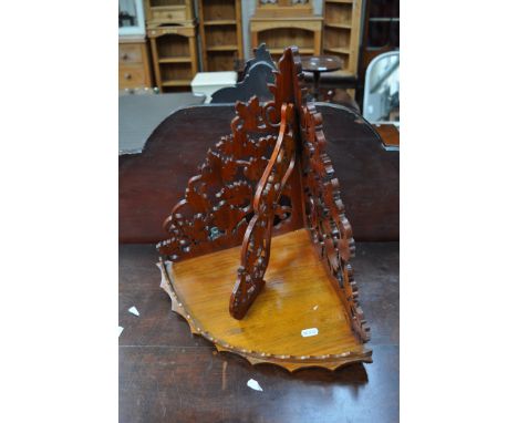 Victorian fretted walnut corner bracket, height 43cm