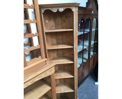 A pine freestanding corner shelf.