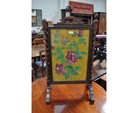 Oak fire screen, barley twist supports inset with a bead work floral panel, height 86cm, width 60cm, a beechwood tray with be