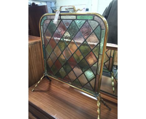 Brass framed stained glass firescreen, width 48cm.