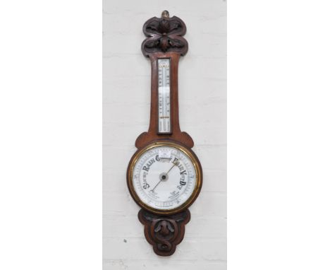 Edwardian carved oak aneroid barometer, ceramic dial, thermometer over.