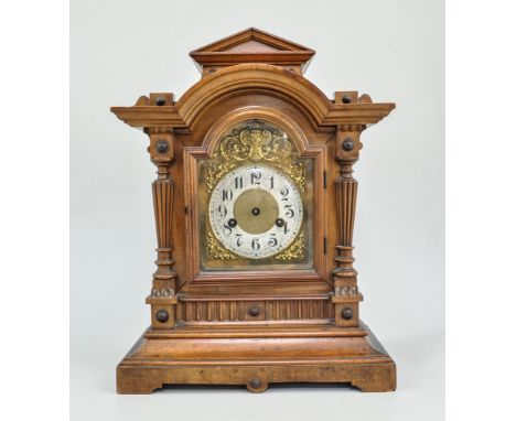 German stained walnut mantel clock, architectural case, with pilaster strips, arched brass dial, cast appliques, fourteen-day