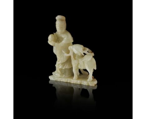 CELADON JADE 'MA GU AND DEER' GROUPQING DYNASTY, 18TH/19TH CENTURY the female Taoist immortal holding a peach beside a deer g