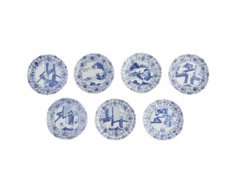 SEVEN BLUE AND WHITE BARBED-RIM DISHESKANGXI PERIOD four painted with a young scholar courting a lady, the fifth with two sch