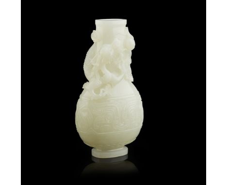 WHITE JADE 'DRAGON' VASEcarved in high relief with a sinuous three-clawed dragon clambering around the neck in pursuit of the