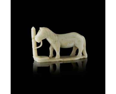 PALE CELADON JADE CARVING OF A TETHERED HORSELATE 19TH/EARLY 20TH CENTURY the horse shown standing foursquare on a thin base,