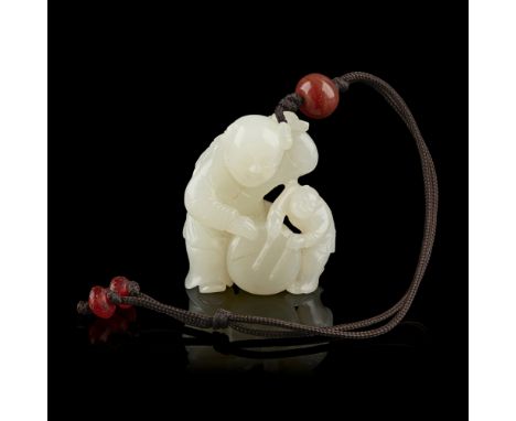 WHITE JADE 'BOYS AND DRUM' CARVINGcarved with a small figure of a boy playing the drum beside a larger figure of a boy holdin